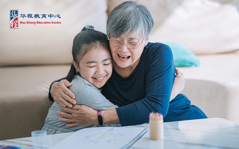 Chinese Grandmother Hugging her Granddaughter