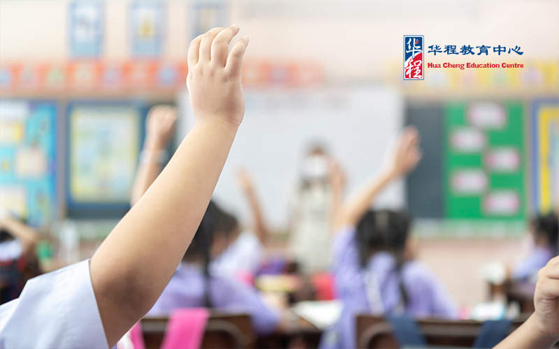 Student Raising Hand in Classroom