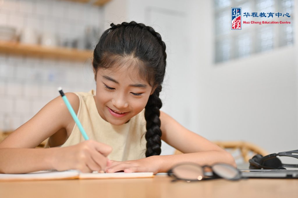 Preteen Girl Doing A Homework At Desk