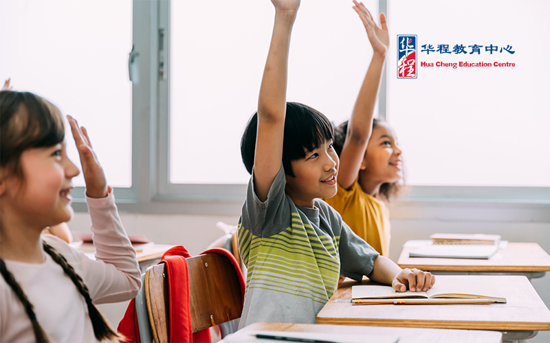 Student Raising Hand in Classroom