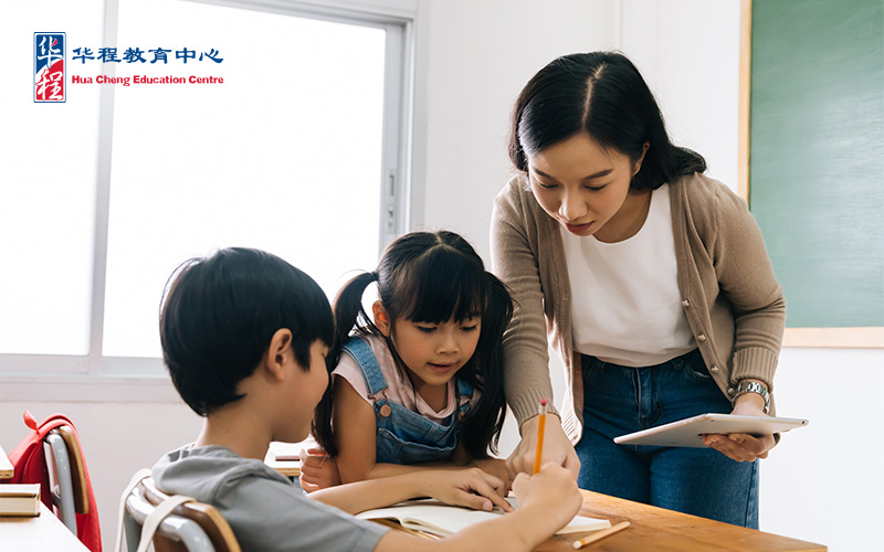 Chinese teacher guiding students learning Chinese