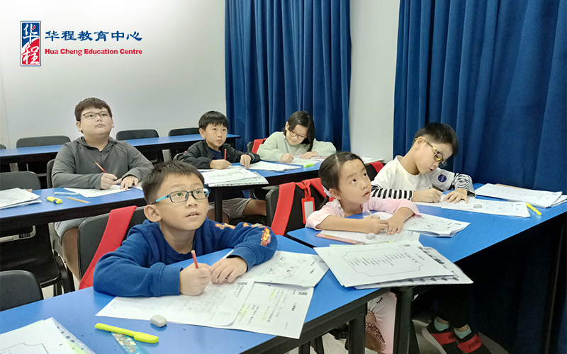 Image of a teacher guiding a student in class